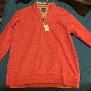 Im selling a medium sized johnnie-o pull over color is amber still has tag on it